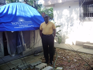 Antoine Atouriste takes online classes at NSU from a make-shift study room in a tent in Haiti.
