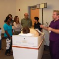 Students and their families hear from current graduate student on how they learn from “Harvey,” a computerized mannequin which duplicates the sounds and symptoms of most heart conditions.