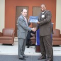 Dean Fields presents certificate to Marcus Davis.