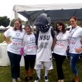 Nova Southeastern University mascot Razor, center, along with NSU student volunteers, supports Special Olympics Broward County at the 2012 Sallarulo’s Race for Champions.