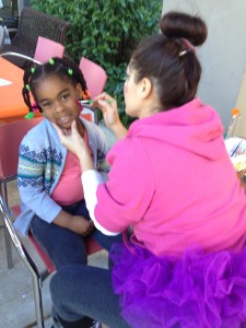  A young girl gets her face painted at Nova Southeastern University College of Dental Medicine’s Give Kids a Smile Day