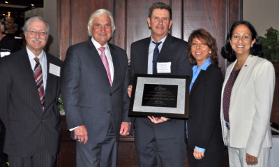 Raymond Ownby (center), M.D., Ph.D., M.B.A., professor and chair of NSU’s College of Osteopathic Medicine (COM) Department of Psychiatry and Behavioral Medicine, received the 3rd Annual Provost’s Research and Scholarship Award in 2013 and was joined by (left to right) Gary Margules, Sc.D., vice president for research and technology transfer; George L. Hanbury II, Ph.D., president and CEO; Robin Jacobs, Ph.D., M.S.W., College of Osteopathic Medicine; and Jacqueline Travisano, M.B.A., C.P.A., executive vice president and COO. 