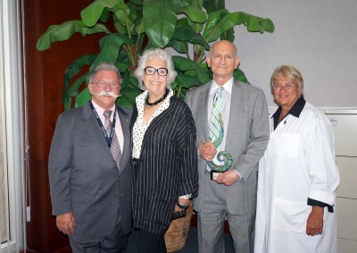 From left: Anthony J. Silvagni, D.O., Pharm.D., M.Sc., FACOFP Dist., Dean Emeritus and Director of International and Interprofessional Medicine; Eleanore and Leonard Levy; and Elaine M. Wallace, D.O., M.S., M.S., M.S., NSU-COM Dean