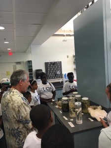 Charles Messing in his lab with students of the Crockett Foundation