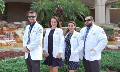 From left, NSU physician students, Jonathan Nusbaum, Kassidy Anthony, Erin Diskin, and Perry Crawford in front of Fort Myers City Hall.