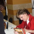 Author Vicki Myron, signing her book Dewey: The Small-town Cat Who Touched the World after her LitLIVE! session.