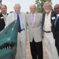Ricardo Belmar, M.I.B.A., NSU Interim Executive Director of Student Educational Centers; Ray Ferrero, Jr., J.D., NSU Chancellor; George L. Hanbury II,  Ph.D., NSU President and CEO; Kent Ullberg, internationally renowned sculptor; and George Dungee, M.B.A., NSU’s Palm Beach Student Educational Center Director; get a close look at the "NSU Underground Shark" statue’s gleaming bronze teeth.
