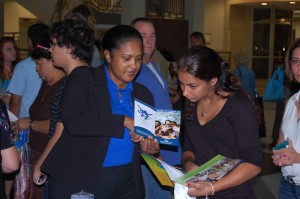 Marilyn Johnson, Manager of the Financial Aid Counselors, discusses finances with a prospective student.