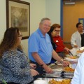 Dean Richard Davis pictured serving the students at the Dean’s Luncheon in Fort Myers.