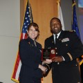 Dr. Hale presents Capt. Filmore with an award to thank him for his participation.