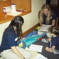Two NSU OT students working with child