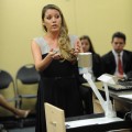 Third-year law student, Brooke Latta, demonstrates the technology in the courtroom.