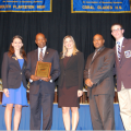 DECA state officers present Interim Dean Preston Jones with an appreciation plaque recognizing the university’s support (left to right: Erica Mick of South Plantation High School; Interim Dean Preston Jones, D.B.A.; Monica Moya from the Huizenga Business School; Arturo Hodgson from the Office of Undergraduate Admissions; and DECA State Vice President Zack Schaja from Marjory Stoneman Douglas High School.