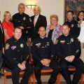 Back row, L to R: NSU Chancellor Ray Ferrero, Jr.; NSU President Emeritus Abraham S. Fischler; Town of Davie Councilmember Susan Starkey; Town of Davie Chief of Police Patrick Lynn; NSU President George Hanbury; Town of Davie were Mayor Judy Paul; Town of Davie Officer K. Rubin; Jacqueline Travisano, NSU Executive Vice President /COO; Jim Ewing, Public Safety Director & Emcee for the event; Pete Witschen, Vice President of Facilities Management.  Seated, L to R: From the Town of Davie: Police Major James Moyer, Officer J. Bogdon, and Officer J. Yaeger.