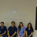 (Left to Right): NSU College of Dental Medicine students  Geoffrey Morris, Ricky G. Pan, Stephanie Maglio and Yi Jey Lin present their display donated by the American Dental Education Association’s Nova Southeastern University Student Chapter.