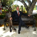 H. Wayne Huizenga Sits on the Newly Unveiled Bench and Statue of Himself