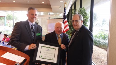  Plantation Chamber 11.13: Plantation Chamber of Commerce Chairman Jack Gleeson presents Fred Lippman, R.Ph., Ed.D., HPD Chancellor; and Irv Rosenbaum, D.P.A., Ed.D., M.P.A., HPD provost and executive dean for administration; with a frame thanking them for NSU’s support of Plantation 