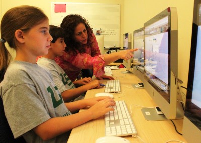 University School students researching stocks online.