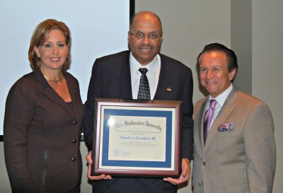 Vice President for Advancement and Community Relations Jennifer O’Flannery Anderson, Ph.D; Napoleon Brandford III, co-founder and chairman of Siebert Brandford Shank & Co., LLC; Huizenga Business School Associate Professor Jack Pinkowski, Ph.D. 