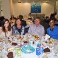 Dinner with the Dean event: Jessica Sanders, M.S., Coordinator of Special Projects (far right) with a family.