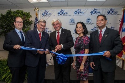 (L to R) Cutting the ribbon: Winel Segarra, student at NSU's College of Pharmacy; Andrés Malavé, Ph.D., executive director of the NSU San Juan campus; George L. Hanbury II, Ph.D., NSU president and CEO; Jacqueline Travisano, M.B.A., NSU Executive Vice President and Chief Operating Officer; and Alexis- Morales-Fresse, student from Abraham S. Fischler School of Education.