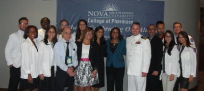 NSU College of Pharmacy Distinguished Alumni Blanca R. Rivera, R.Ph., C.Ph., M.Pharm., M.B.A., and Christopher G. Lynch, Pharm.D., M.Ed., pose with students and faculty.