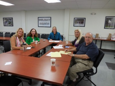 NSU representatives meeting with representatives from the Alliance of Delray Residential Associations, Inc. From left to right: Kristi Messer, M.P.H., M.S.W., director of disaster and emergency preparedness at NSU’s College of Osteopathic Medicine; Jo Ann Kleier, Ph.D., Ed.D., ARNP, ACNP-BC, professor director of research at NSU’s College of Nursing; Deirdre Krause, Ph.D., ARNP, FNP-BC, associate professor of nursing at NSU’s Palm Beach Campus; Lori Vinikoor, D.P.M., executive vice president & program chair, Alliance of Delray Residential Associations, Inc.; and Bob Schulbaum, president, Alliance of Delray Residential Associations, Inc.