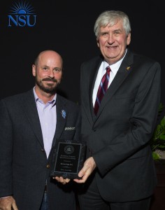 Bernhard Riegl, Ph.D., Chair of Marine and Environmental Sciences, Professor, Halmos College of Natural Sciences and Oceanography with External Funding Recognition plaque; Ralph Rogers, Ph.D., Provost and Executive Vice-President for Academic Affairs.