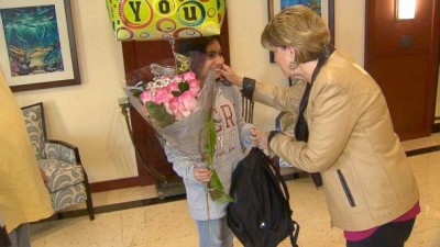 NSU's Dr. Wren Newman returns lost backpack to young girl (courtesy WPLG)