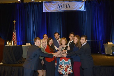 Linda Niessen, D.M.D., M.P.H., M.P.P. (center) and students from College of Dental Medicine.