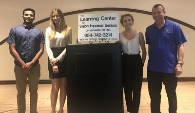 Halmos Students Mithun Mathew, Kaleigh Neidig, Alexa Israeli and Associate Professor Mark Jaffe, D.P.M. at The Learning Center for Vision Impaired Seniors