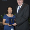 Yin C. Tea, O.D., FAAO, Chief of Pediatrics and Binocular Vision, Assistant Professor, College of Optometry with External Funding Recognition plaque; Ralph Rogers, Ph.D., Provost and Executive Vice President for Academic Affairs