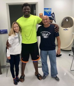 From Left, graduate student, Anya Ellerbroek, EXSC student, Sunny Odogwu, and associate professor, Jose Antonio, taking a quick break during data collection for the NFL combine study.