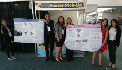 Research Team holding their 3D Molecular Modeling Posters The Research Team pictured left to right (Gwen Bui, Allan Barraza, Viviana Perez Hernandez, Emily Schmitt Lavin, Ph.D., professor and Chair Department of Biological Sciences, Sophia Nguyen, and Alesa Chabbra) 