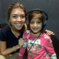 Audiology student Kasia Baginski with one of the children who received a hearing assessment in Nicaragua.