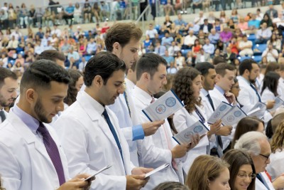 Members of the NSU Dr. Kiran C. Patel College of Allopathic Medicine recite the modern Hippocratic Oath.
