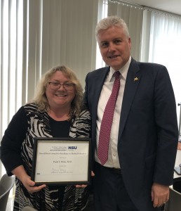 NSU MD Dean Johannes Vieweg, M.D., FACS, presents the inaugural Darrell Kirch Award for Excellence in Medical Education to Paula S. Wales, Ed.D. 
